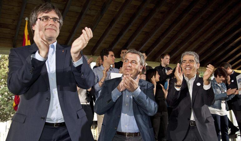 Jordi Xuclá junto a Carles Puigdemont y Francesc Homs en un acto del Partido Demócrata Catalán