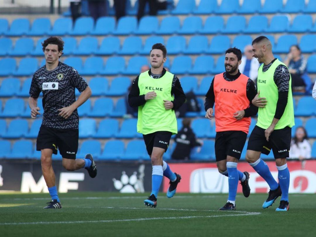 Nani y Miranda, calentando en antes de un partido