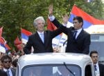 The new Uruguayan President Tabare Vazquez (L) and his Vice President Raul Sendic wave at the crowd gathering along his way from the Legislative Palace to Independence Square in Montevideo on March 1, 2015. Cancer doctor Tabare Vazquez was sworn in as Uru