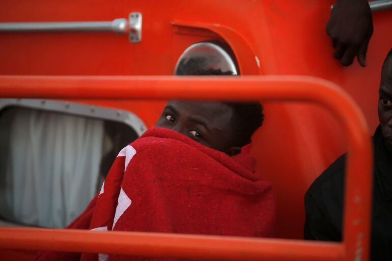 A migrant intercepted aboard a dinghy off the coast in the Mediterranean Sea, is seen on a rescue boat after arriving at the port of Malaga, southern Spain July 18, 2018 REUTERS Jon Nazca