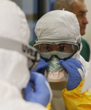 Red Cross volunteers get trained on November 19, 2014 in Paris before intervening in zones where the deadly disease is not over. The worst ever outbreak of the virus has killed almost 5,200 people, mostly in west Africa with the largest number of casualti