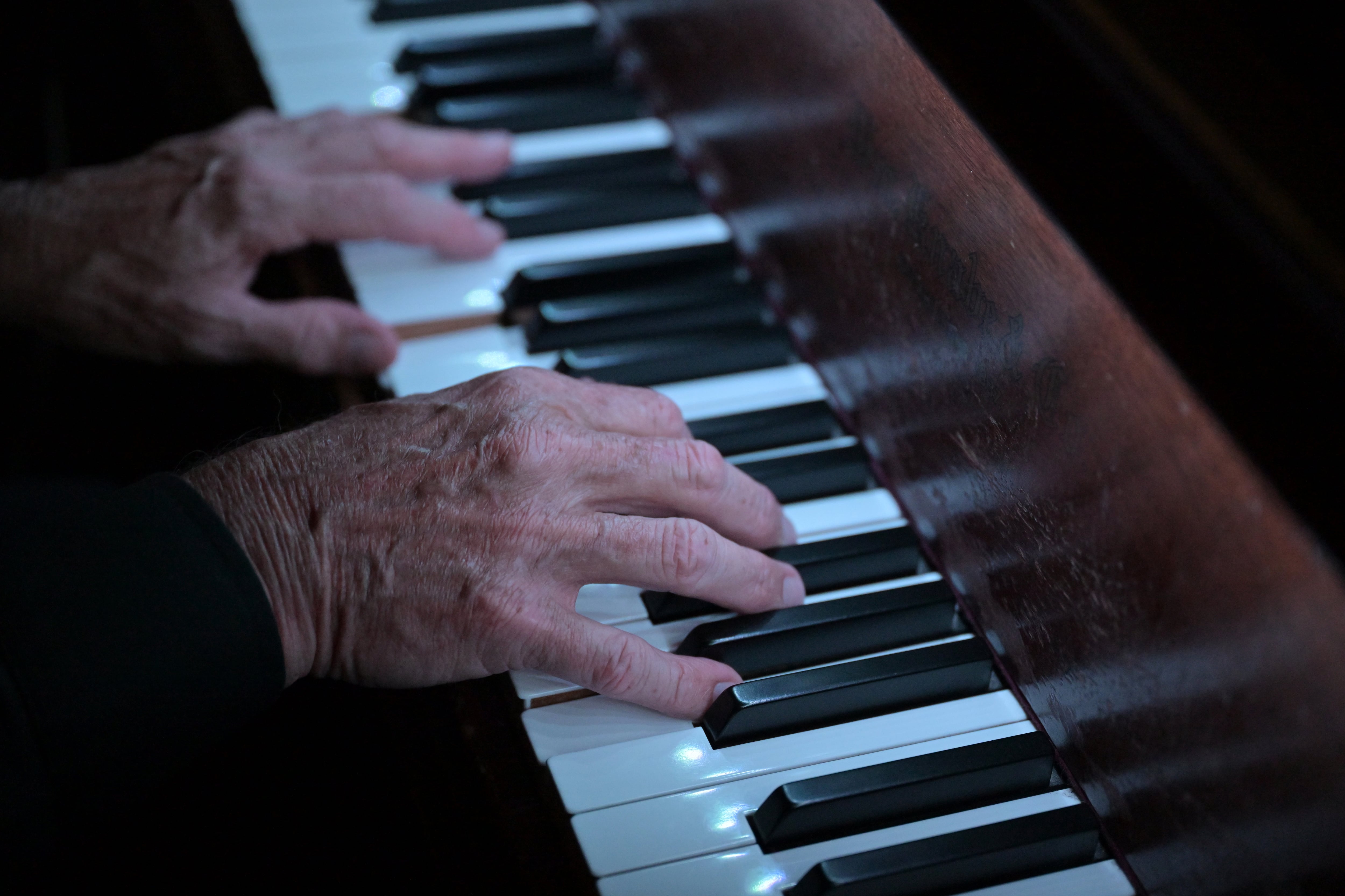 DENVER, COLORADO- MAY 29: John Hayden plays the piano for customers at Charlie Brown's Bar & Grill in Denver, Colorado on May 29, 2025. (Photo by RJ Sangosti/MediaNews Group/The Denver Post via Getty Images)