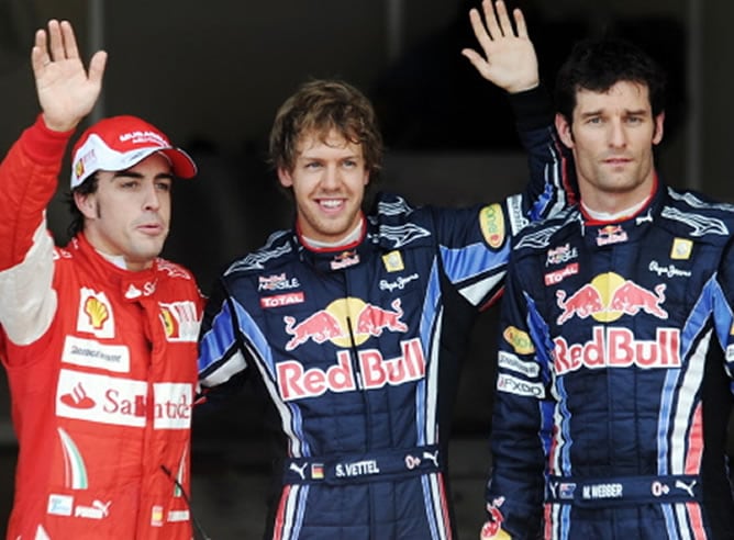 Vettel, Webber y Alonso tras la sesión de clasificación en Silverstone / AFP