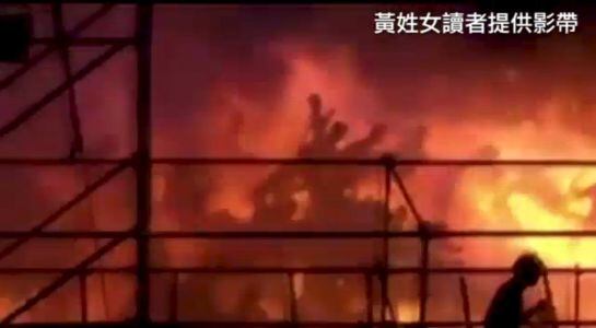 Silhouettes of people running from a blaze are seen at the Formosa Fun Coast water park, on the outskirts of the capital, Taipei in this still image taken from video shot on June 27, 2015 and provided by Apple Daily Taiwan. The number of people injured in