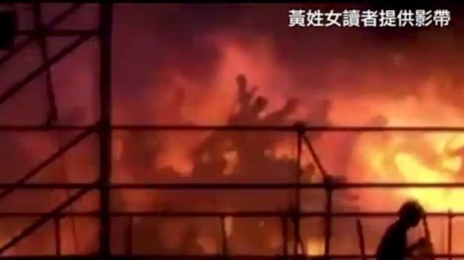 Silhouettes of people running from a blaze are seen at the Formosa Fun Coast water park, on the outskirts of the capital, Taipei in this still image taken from video shot on June 27, 2015 and provided by Apple Daily Taiwan. The number of people injured in