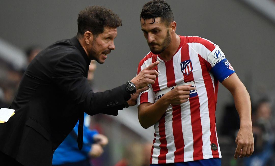 Simeone y Koke, en el último partido entre el Atlético de Madrid y el Valencia.