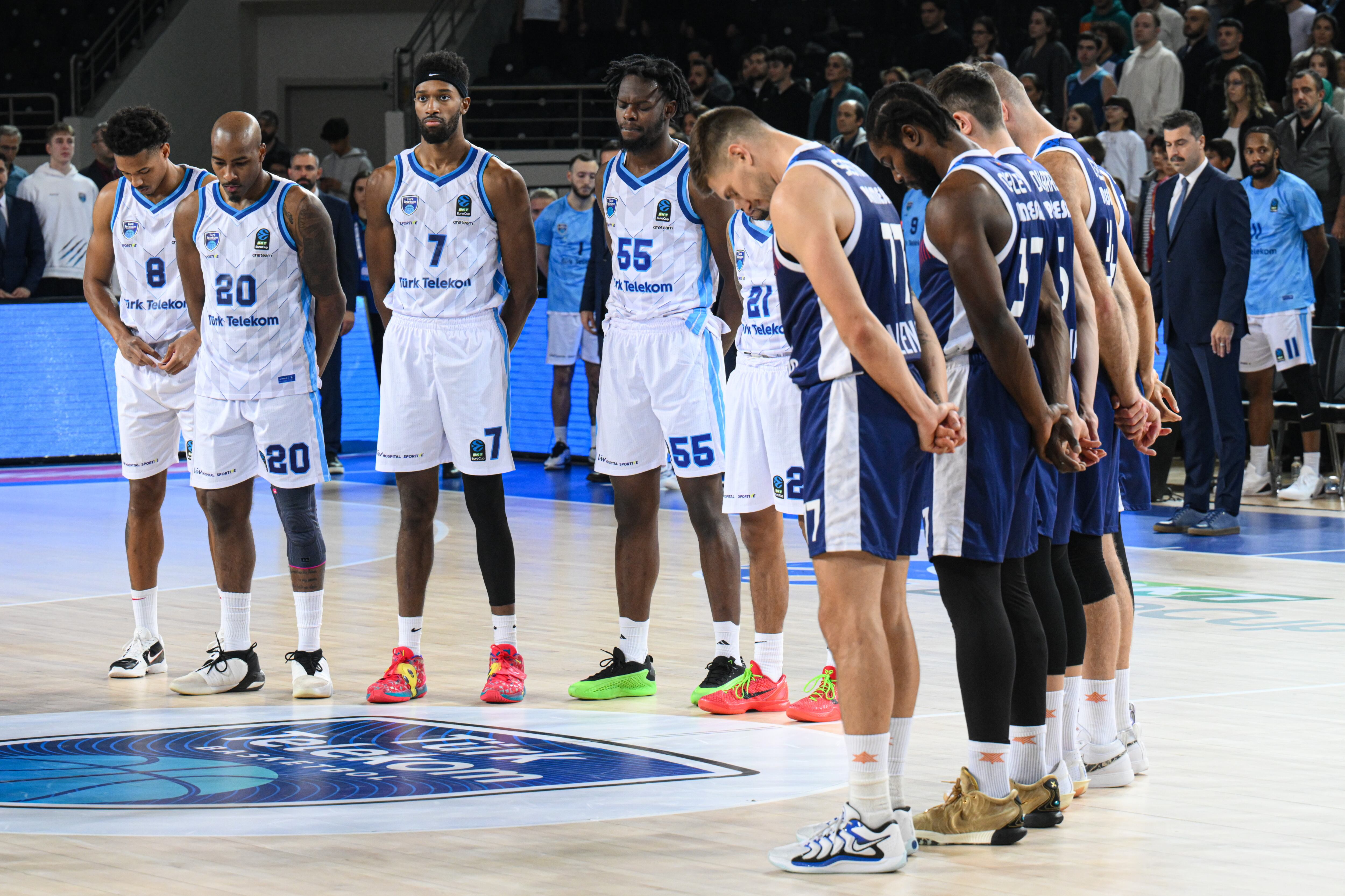 ANKARA, TURKIYE - OCTOBER 23: Players sing the Turkish National Anthem and observe a minute&#039;s silence due to the terrorist attack targeting the facilities of Turkish Aerospace Industries (TAI), ahead of the BKT EuroCup Group B week 5 basketball match between Turk Telekom and Valencia Basket at Ankara Sports Hall on October 23, 2024. (Photo by Akin Celiktas/Anadolu via Getty Images)