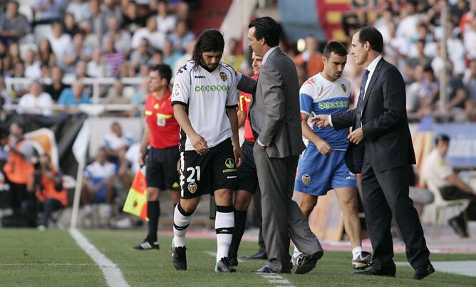 Banega y Emery, durante un partido del Valencia