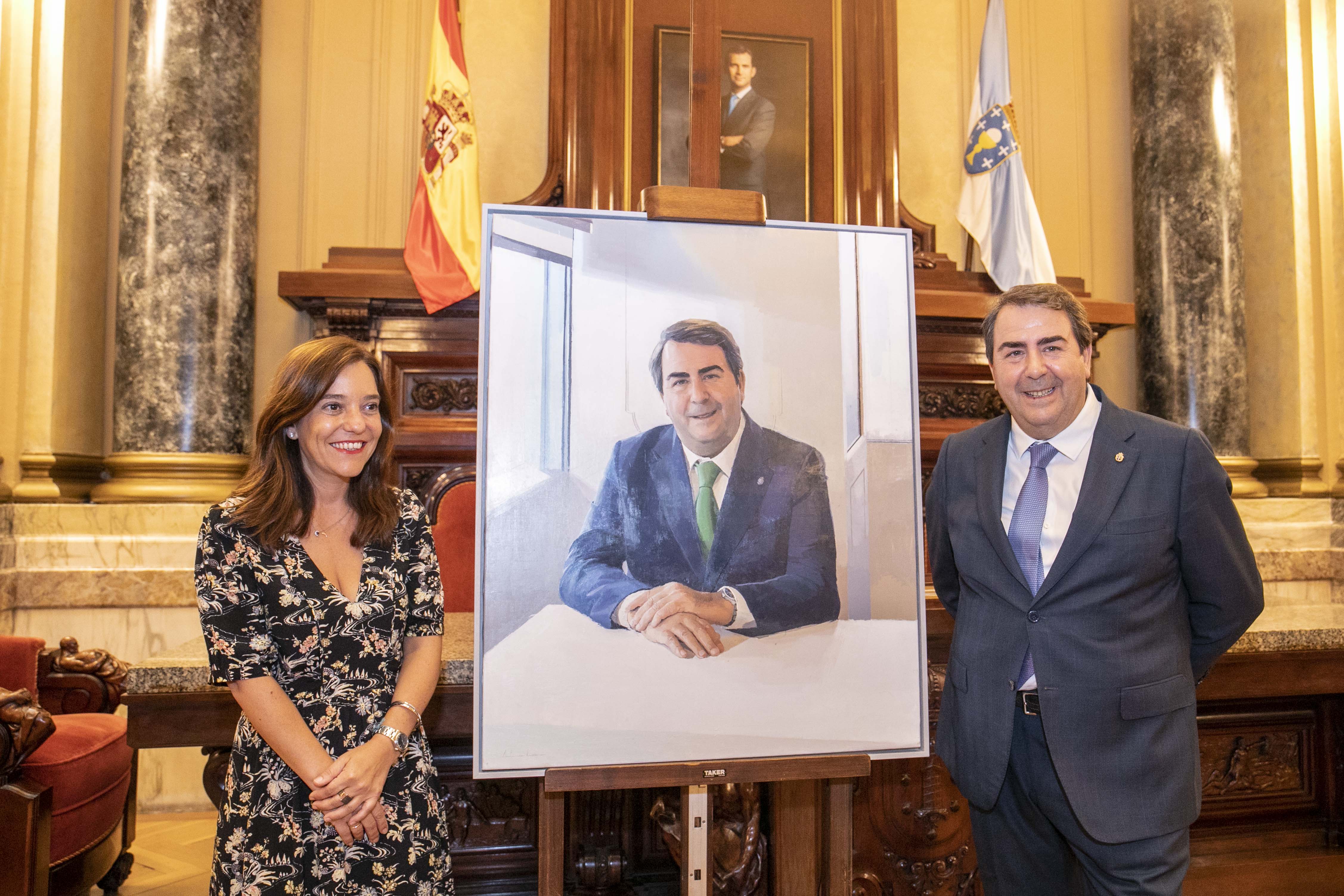 El retrato de Carlos Negreira entre Inés Rey y el propio Carlos Negreira