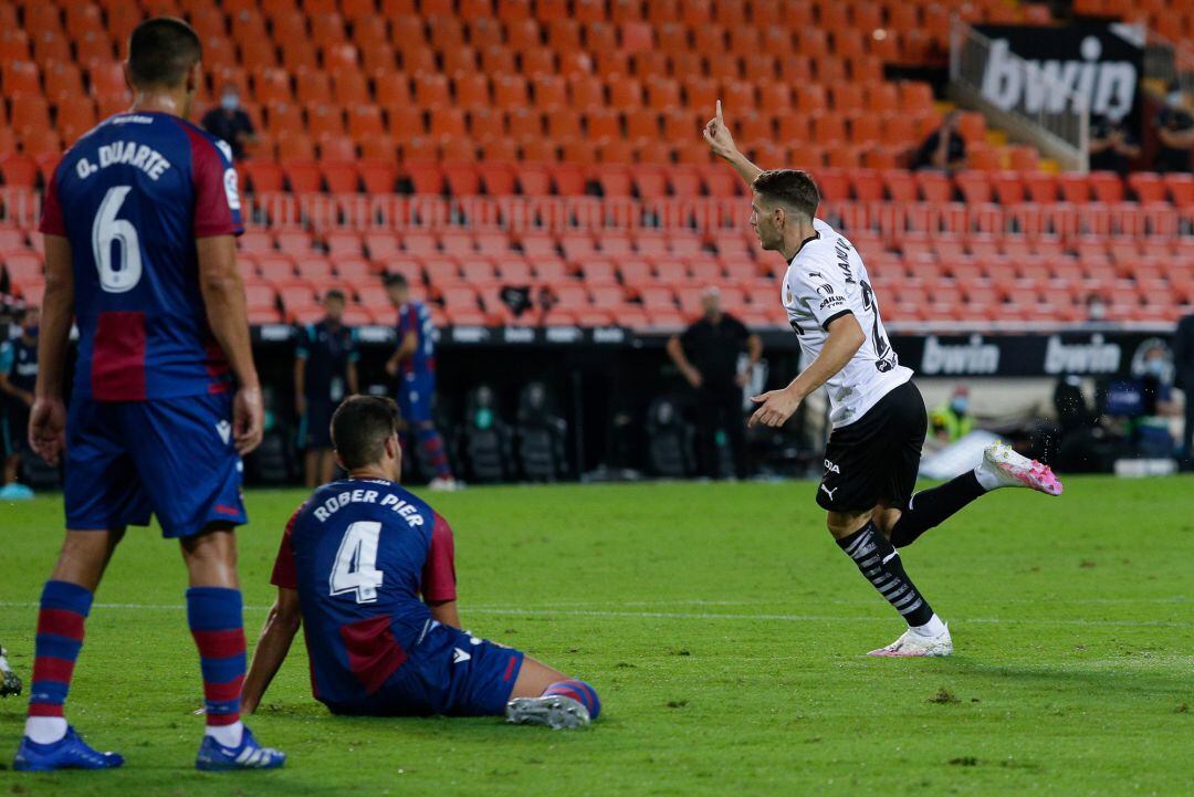 Manu Vallejo of Valencia CF celebrates after scoring his team's third goal during the La Liga match between Valencia CF and Levante UD at Estadio Mestalla
