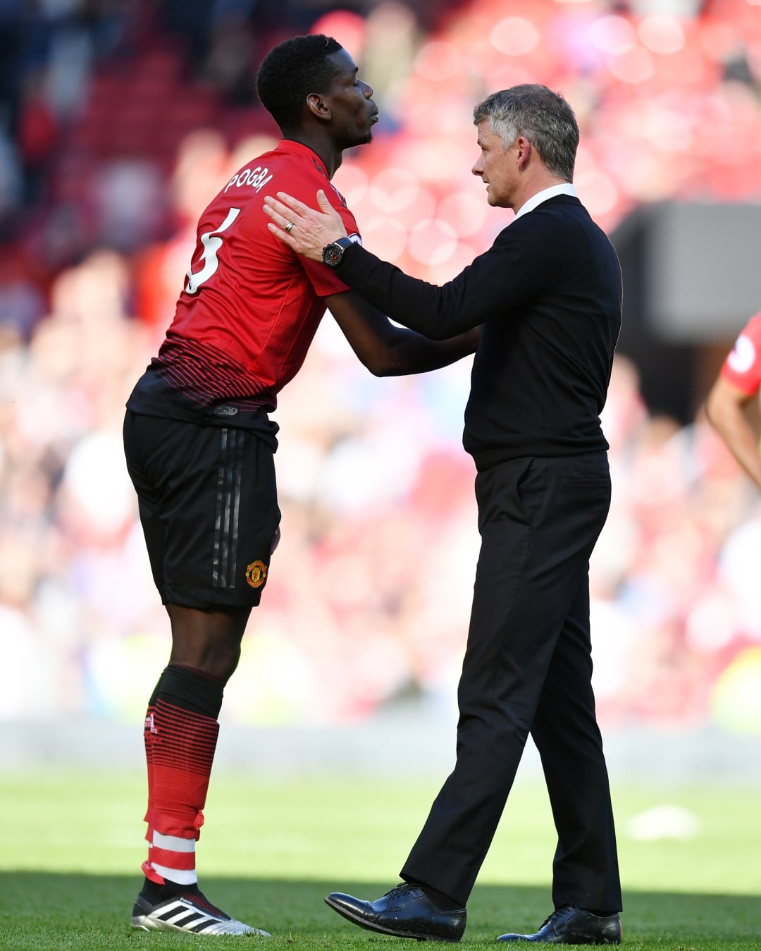 Paul Pogba y Solksjaer, durante un partido del Manchester United