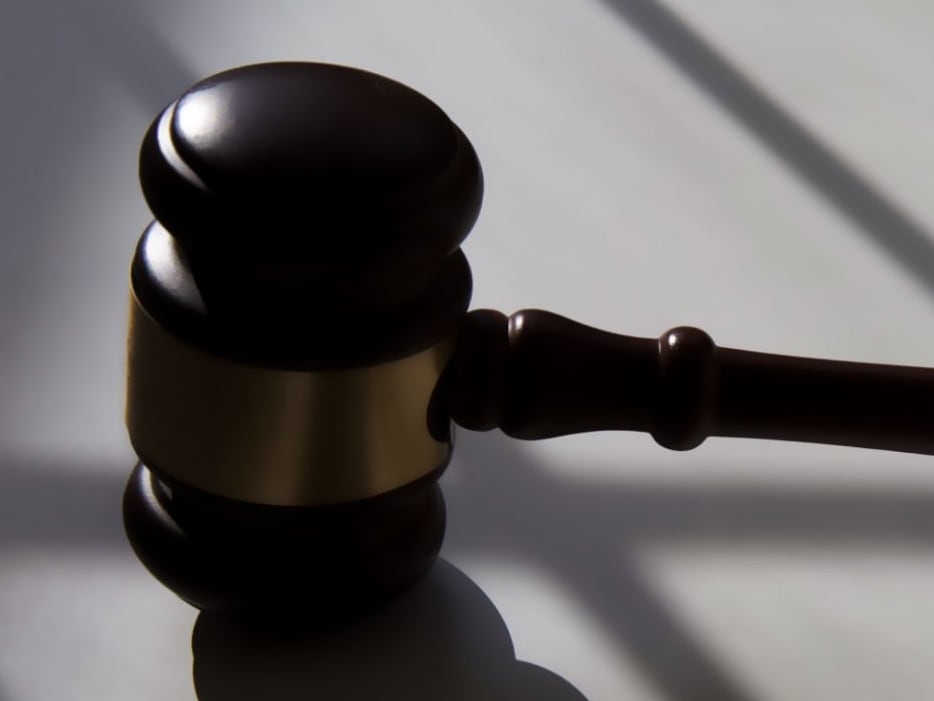 gold-trimmed wooden judicial gavel