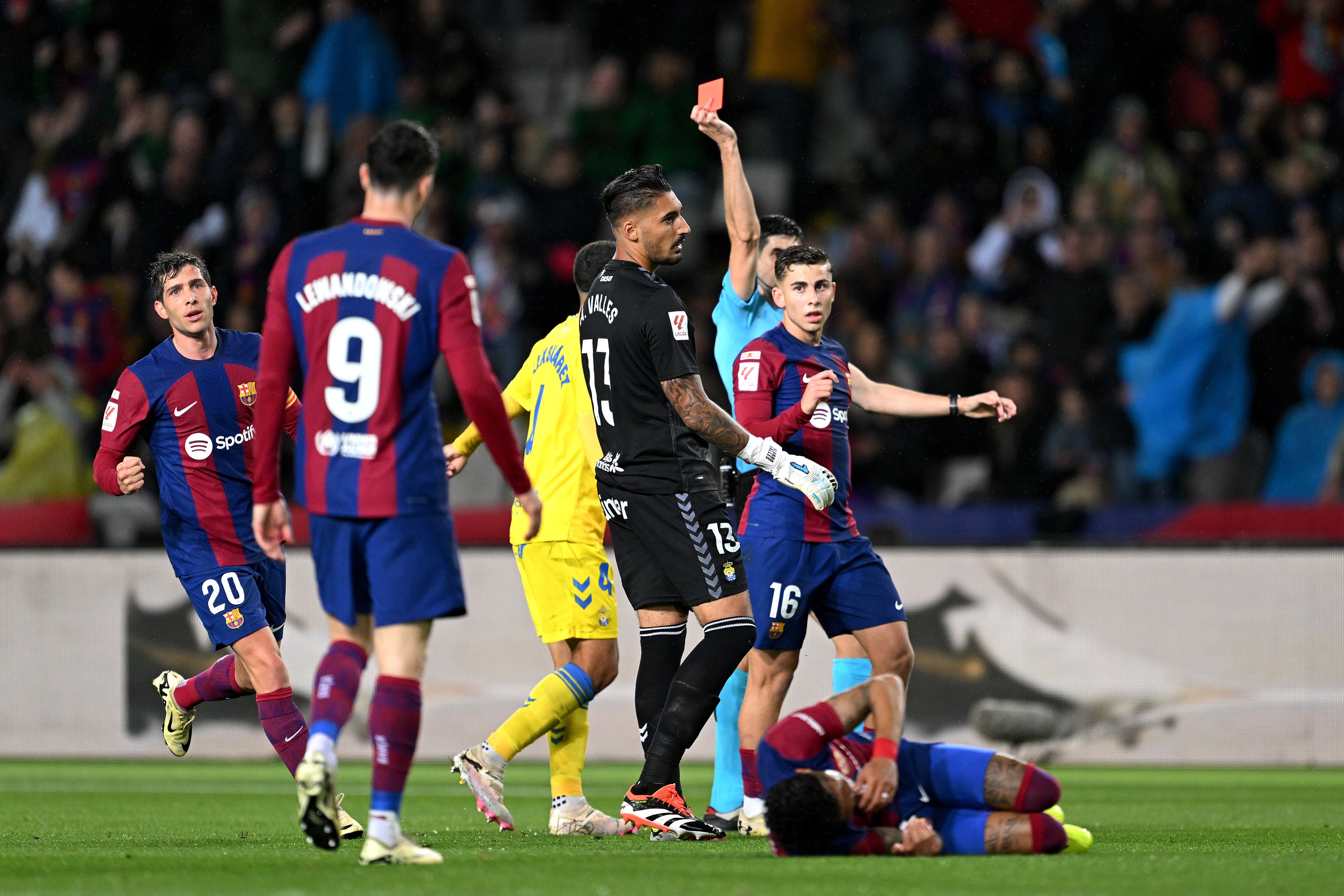 BARCELONA, SPAIN - MARCH 30: Alvaro Valles of UD Las Palmas is shown a red card during the LaLiga EA Sports match between FC Barcelona and UD Las Palmas at Estadi Olimpic Lluis Companys on March 30, 2024 in Barcelona, Spain. (Photo by David Ramos/Getty Images)