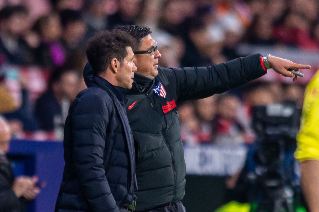 Simeone y Germán Burgos, en un partido del Atlético de Madrid.