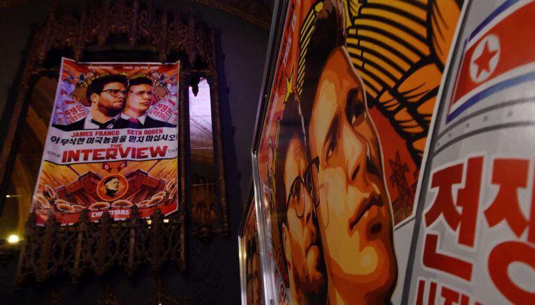 (FILES) In this December 11, 2014 file photo, posters are seen outside The Theatre at Ace Hotel before the premiere of the film &quot;The Interview&quot; in Los Angeles, California. The film, starring US actors Seth Rogen and James Franco, is a comedy about a CIA p