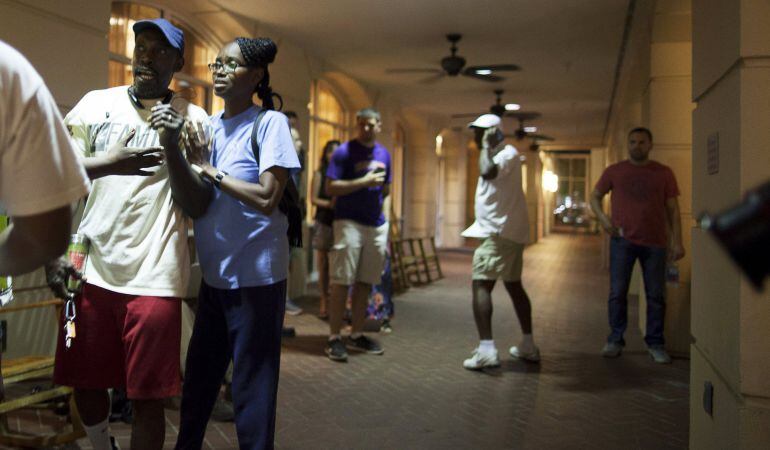 People concerned about relatives seek information from police nearby the scene of a shooting at the Emanuel AME Church in Charleston, South Carolina, June 17, 2015. A gunman opened fire on Wednesday evening at the historic African-American church in downt