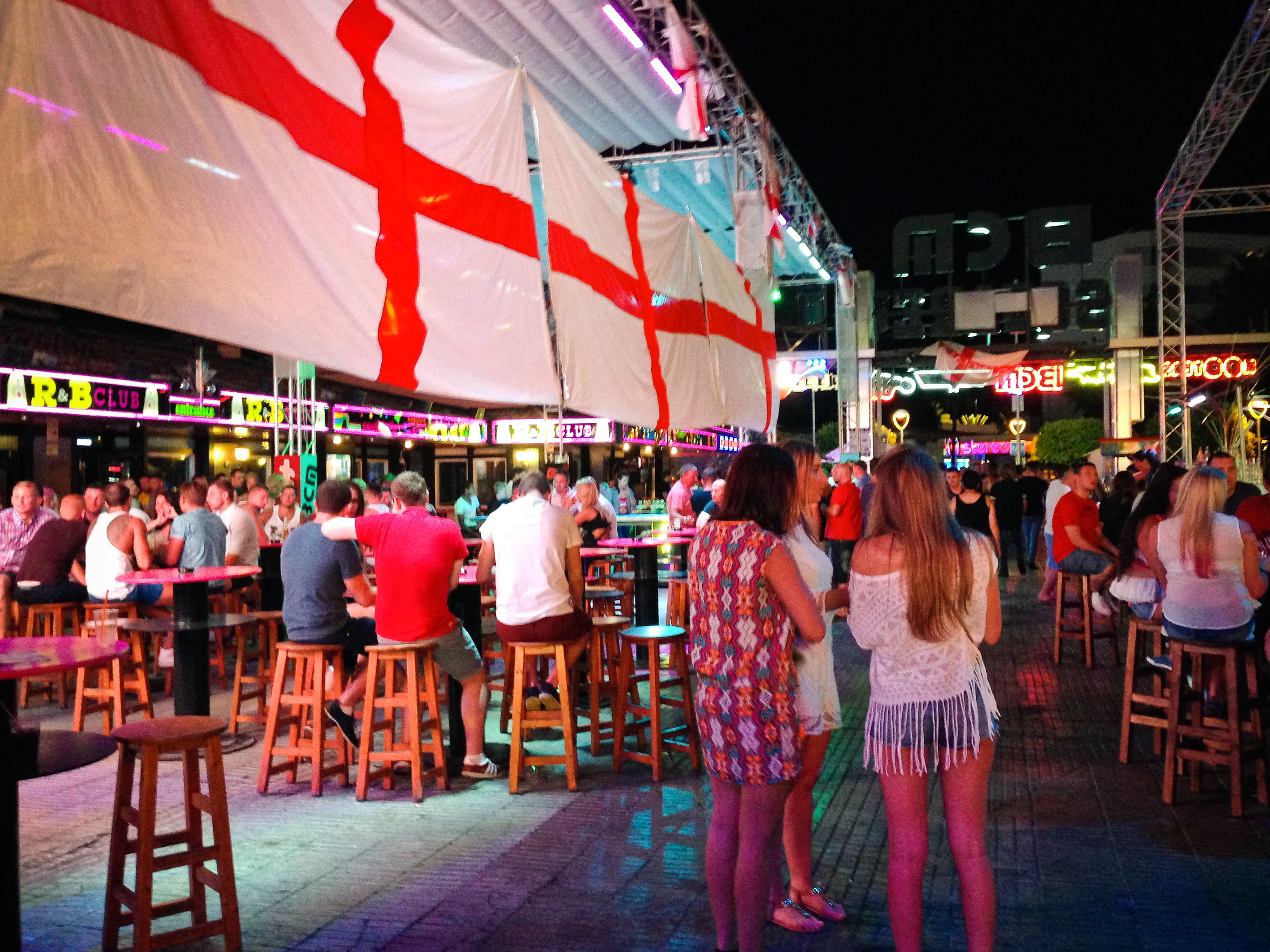 MALLORCA, SPAIN - JULY 12:  Tourists are seen enjoying the atmosphere of a local bar on Punta Ballena Street, also known as &quot;the strip&quot; on July 12, 2014 in Mallorca, Spain. Magaluf is one of the Britain&#039;s favorite holiday destinations popular because of it&#039;s beautiful beaches, bars, and active nightlife.  (Photo by David Ramos/Getty Images)