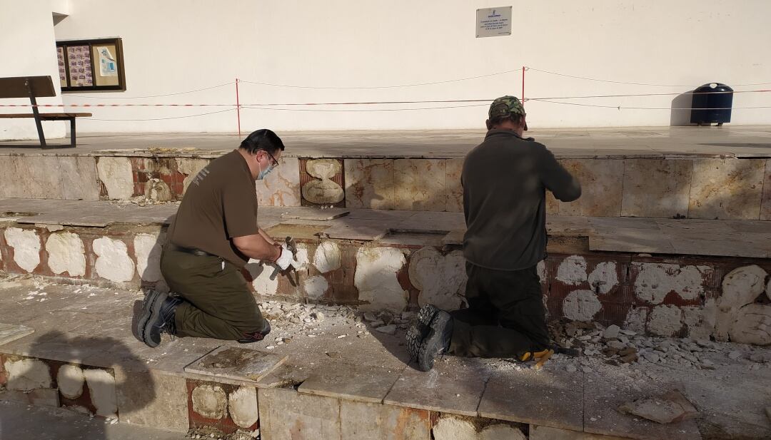 Trabajadores en un taller Recual