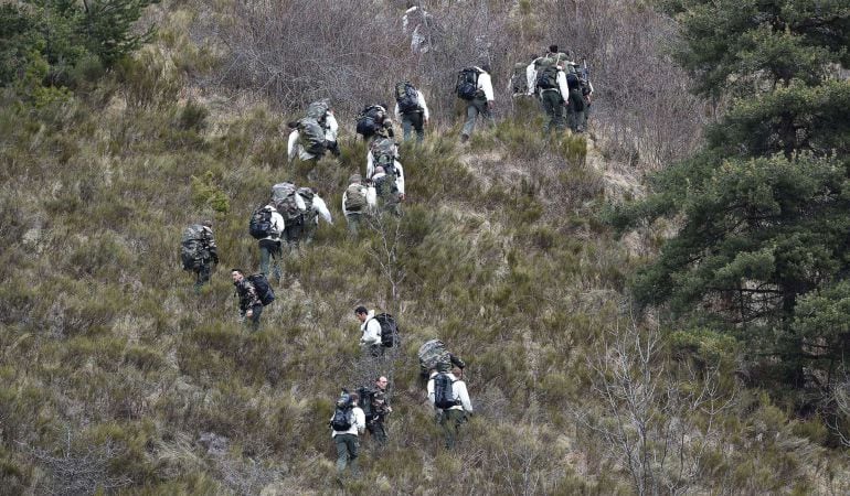 TOPSHOTS French soldiers of the 4th Hunter Regiment of Gap patrol on March 25, 2015 near the site where a Germanwings Airbus A320 crashed on March 24 in the French Alps near Seyne-les-Alpes, south-eastern France. A German airliner crashed near a ski reso