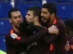 Soccer Football - La Liga Santander - Espanyol vs FC Barcelona - RCDE Stadium, Barcelona, Spain - February 4, 2018 Barcelona’s Gerard Pique celebrates with Sergio Busquets and Luis Suarez after scoring their first goal REUTERS/Albert Gea