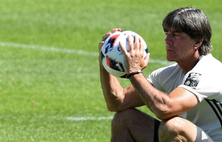 Germany&#039;s head coach Joachim Loew looks at a ball during a training session of the German national soccer team in Evian, France, 04 July 2016. Germany will face France in the UEFA EURO 2016 semi-finals match in Marseille on 07 July 2016. (Marsella, Aleman