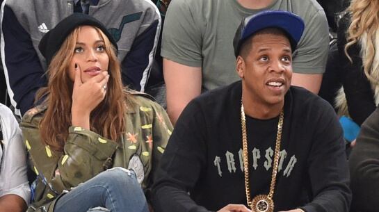 BeyoncxE9 and Jay Z attend the 64th NBA All-Star Game at Madison Square Garden in New York February 15, 2015. AFP PHOTO / TIMOTHY A. CLARY