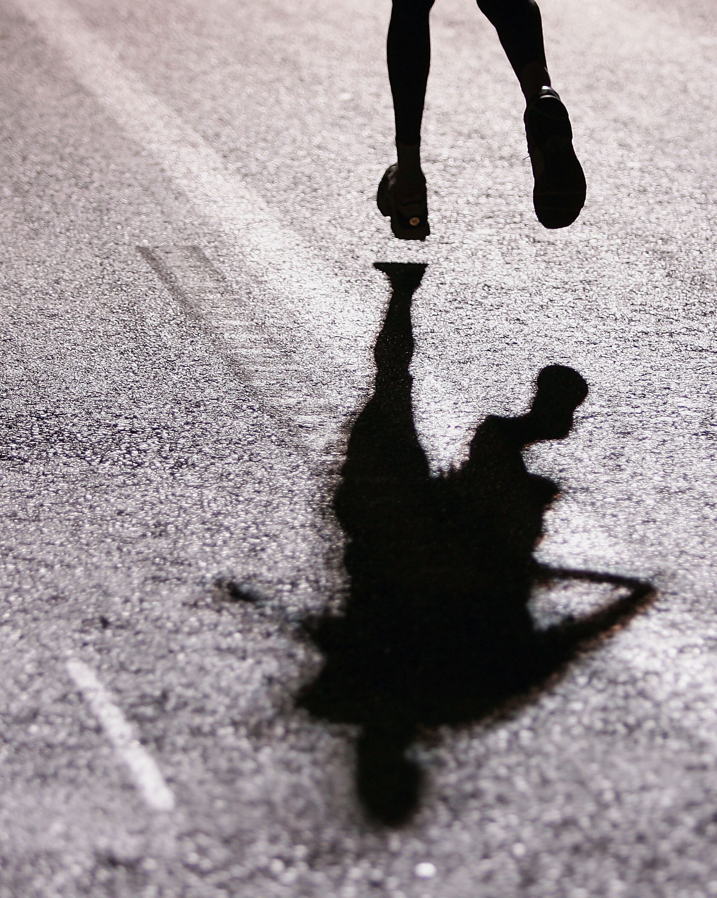 ATHENS - AUGUST 29:  A marathon runner heads for the finish line in the men&#039;s marathon on August 29, 2004 during the Athens 2004 Summer Olympic Games at Panathinaiko Stadium in Athens, Greece.  (Photo by Nick Laham/Getty Images)