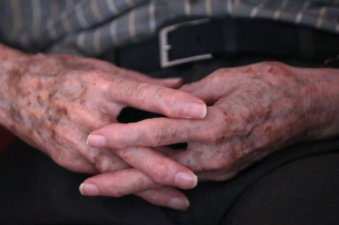Hands of a resident are pictured at the house for elderly Residence Christalain during coronavirus disease (COVID-19) outbreak, in the Brussels commune of Jette, Belgium April 13, 2020.