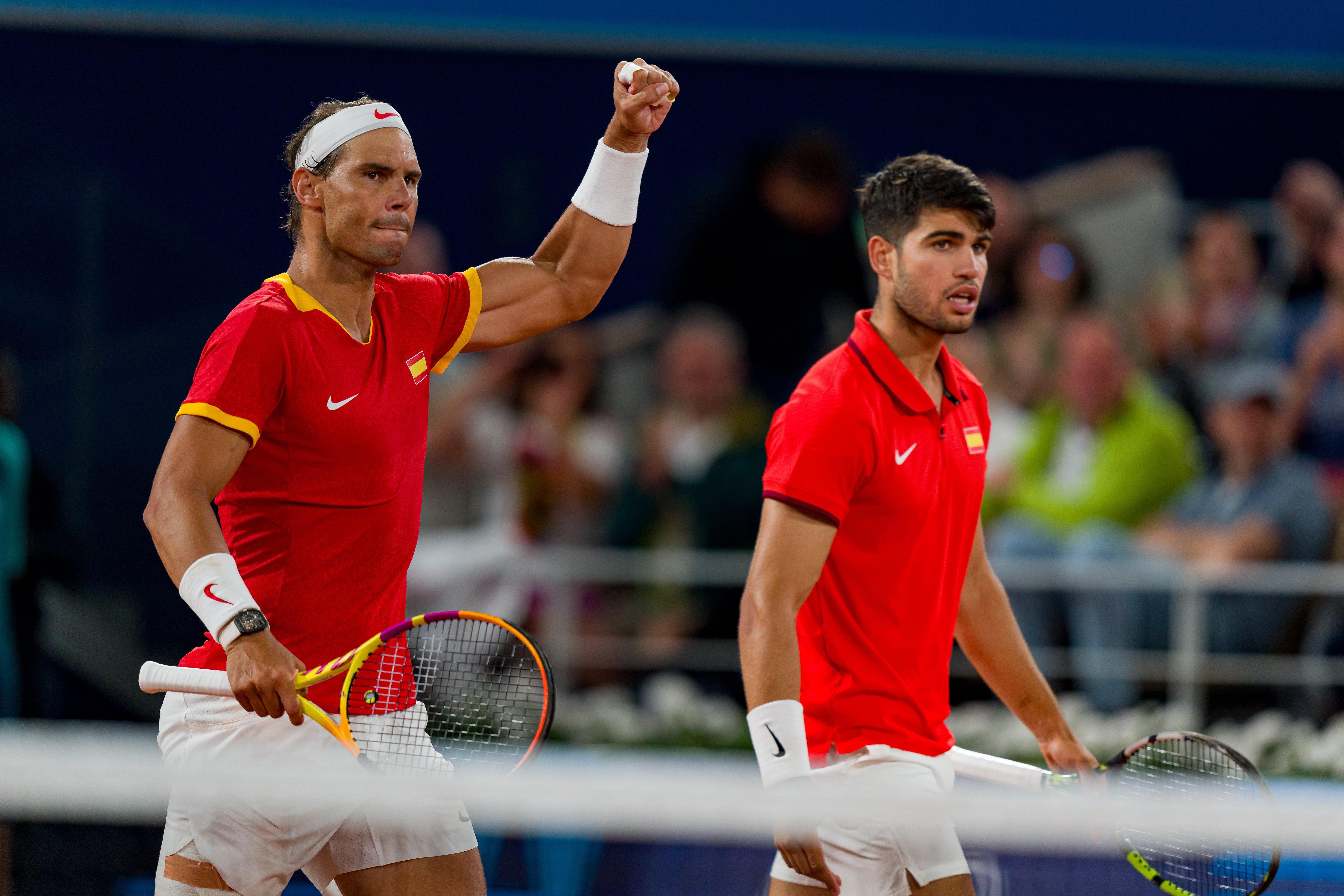 Rafael Nadal y Carlos Alcaraz celebran un punto ante los argentinos Andrés Molteni y Máximo González