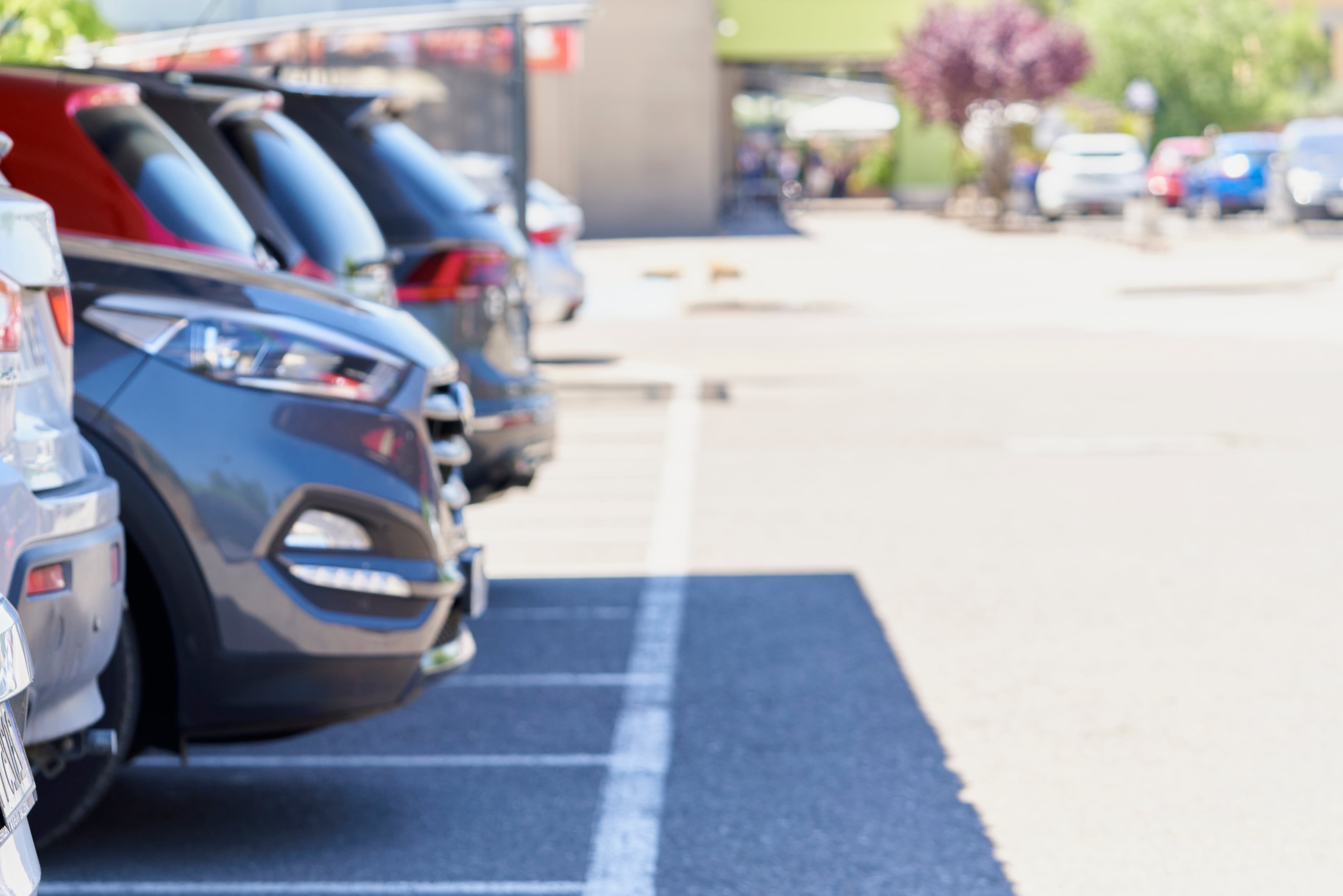 car parking lots outside a shopping mall or market, profile view with stripes on the pavement