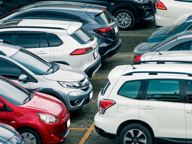 Car parked at parking lot of the airport for rental. Aerial view of car parking lot of the airport. Used luxury car for sale and rental service. Automobile parking space. Car dealership concept.