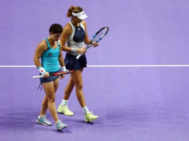 Muguruza y Carla Suárez durante un partido de dobles