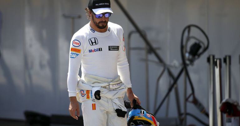 McLaren F1 driver Fernando Alonso of Spain walks after the qualifying session of the Spanish Grand Prix at the Circuit de Barcelona-Catalunya racetrack in Montmelo, near Barcelona, Spain, May 9, 2015. REUTERS/Juan Medina