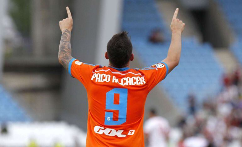 Valencia&#039;s forward Paco Alcacer celebrates after scoring  during the Spanish league football match UD Almeria vs Valencia CF at the Juegos Mediterraneos stadium in Almeria on May 23, 2015.  AFP PHOTO / JOSE JORDAN