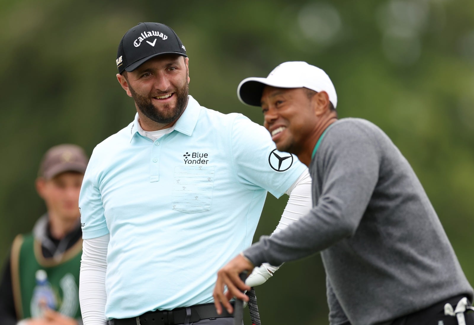 Jon Rahm y Tiger Woods, en un torneo