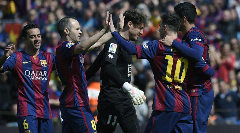 (L to R) Barcelona&#039;s midfielder Xavi Hernandez , Barcelona&#039;s midfielder Andres Iniesta , Barcelona&#039;s Argentinian forward Lionel Messi, Barcelona&#039;s Uruguayan forward Luis Suarez celebrate after scoring during the Spanish league football match FC Barcelona 