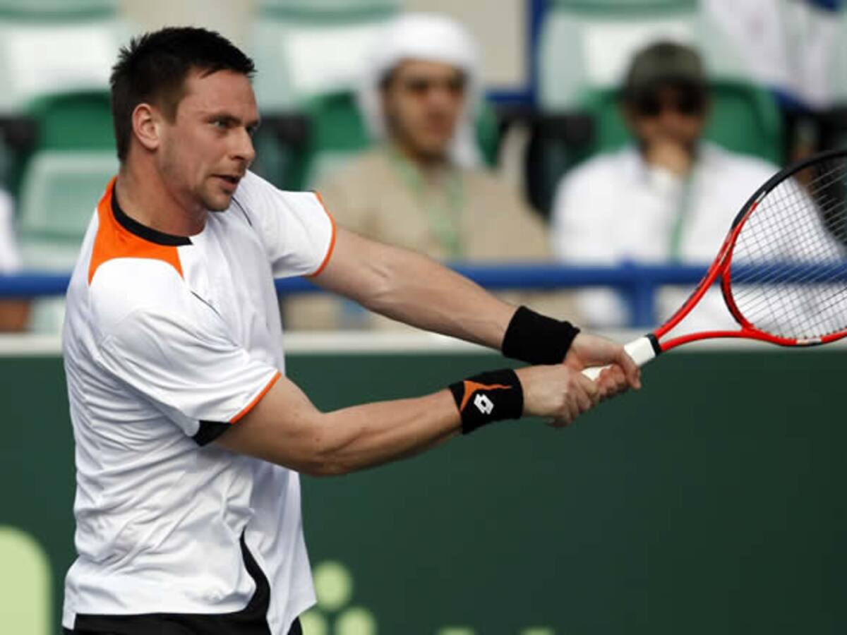 Robin Soderling en el partido contra Roger Federer en Abu Dhabi