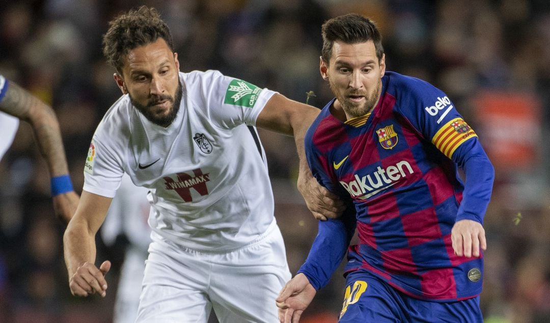 Germán, en una acción con Leo Messi.