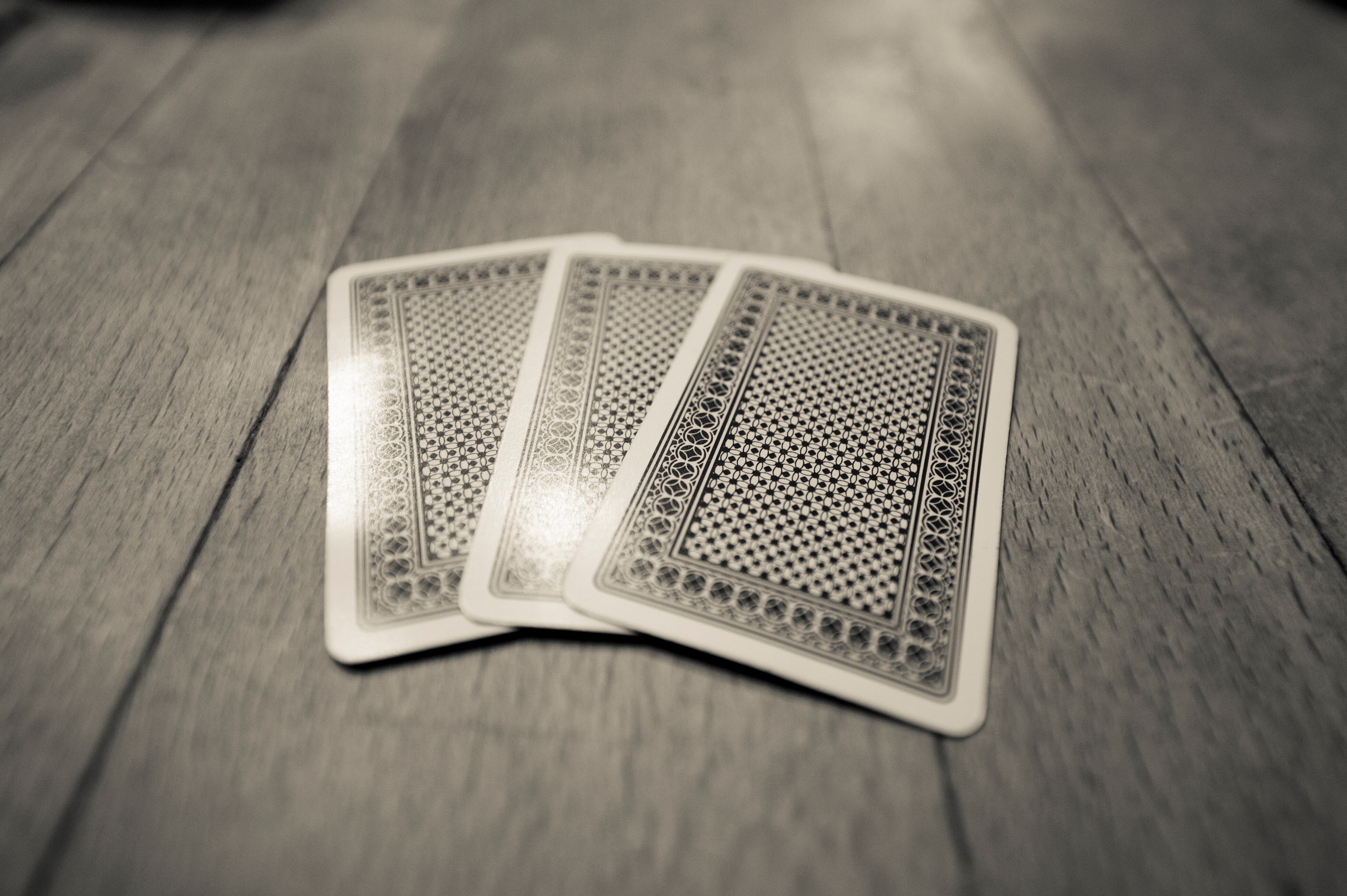 Playing cards on a wooden table.