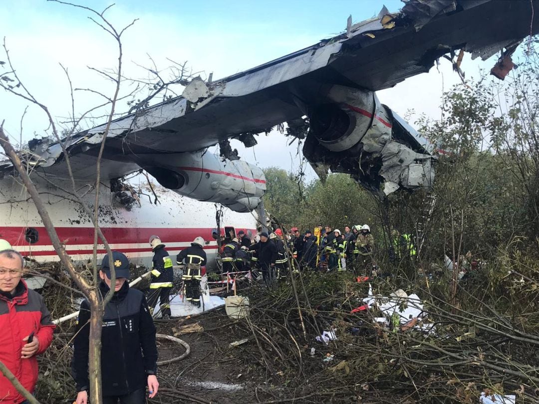 Members of emergency services work at the site of the Antonov-12 cargo airplane emergency landing in Lviv region, Ukraine October 4, 2019. Lviv Mayor&#039;s Office Handout via REUTERS