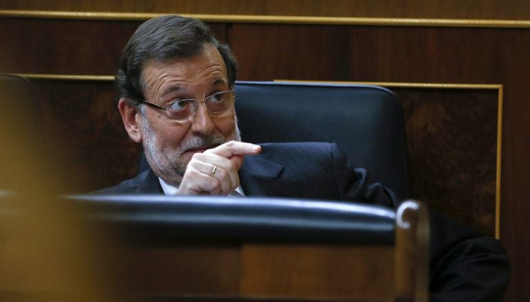 GRA516. MADRID, 24/02/2015.- El presidente del Gobierno, Mariano Rajoy, durante la sesión de tarde de la primera jornada del vigésimo quinto debate del estado de la nación, la cita parlamentaria anual más importante del año, que se celebra hoy en la Cámar