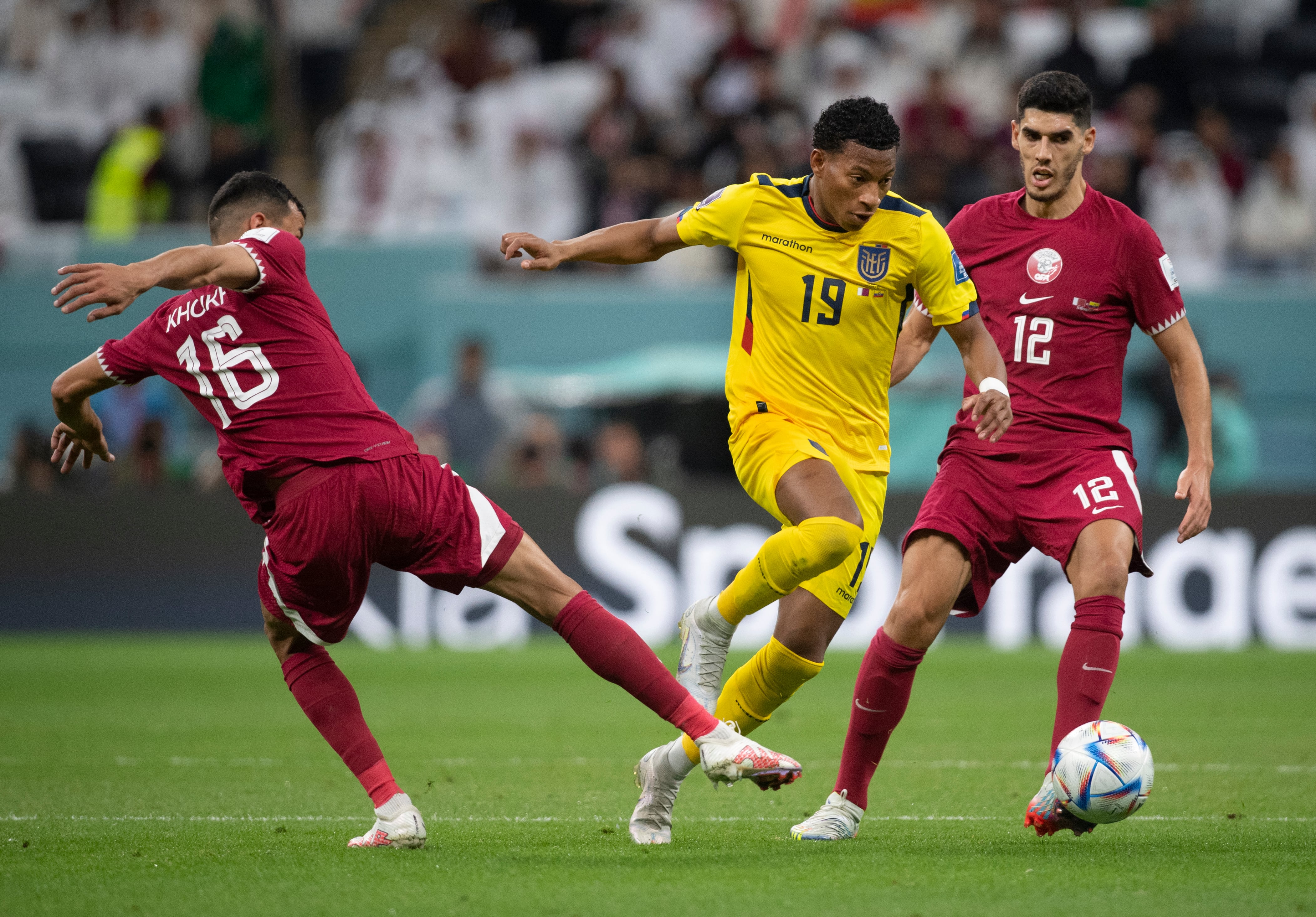 AL KHOR, QATAR - NOVEMBER 20: Karim Boudiaf and Boualem Khoukhi of Qatar with Gonzalo Plata of Ecuador in action during the FIFA World Cup Qatar 2022 Group A match between Qatar and Ecuador at Al Bayt Stadium on November 20, 2022 in Al Khor, Qatar. (Photo by Visionhaus/Getty Images)