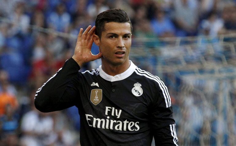 Real Madrid's Cristiano Ronaldo celebrates his goal against Espanyol during their Spanish first division soccer match at Power8 stadium in Cornella de Llobregat near Barcelona May 17, 2015. REUTERS/Gustau Nacarino