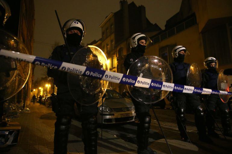 SINT-JANS-MOLENBEEK, BELGIUM - MARCH 18:  Police officers patrol after raids in which several people, including Paris attacks suspect Salah Abdeslam, were arrested on March 18, 2016 in Sint-Jans-Molenbeek, Belgium. Belgian police arrested three people in 