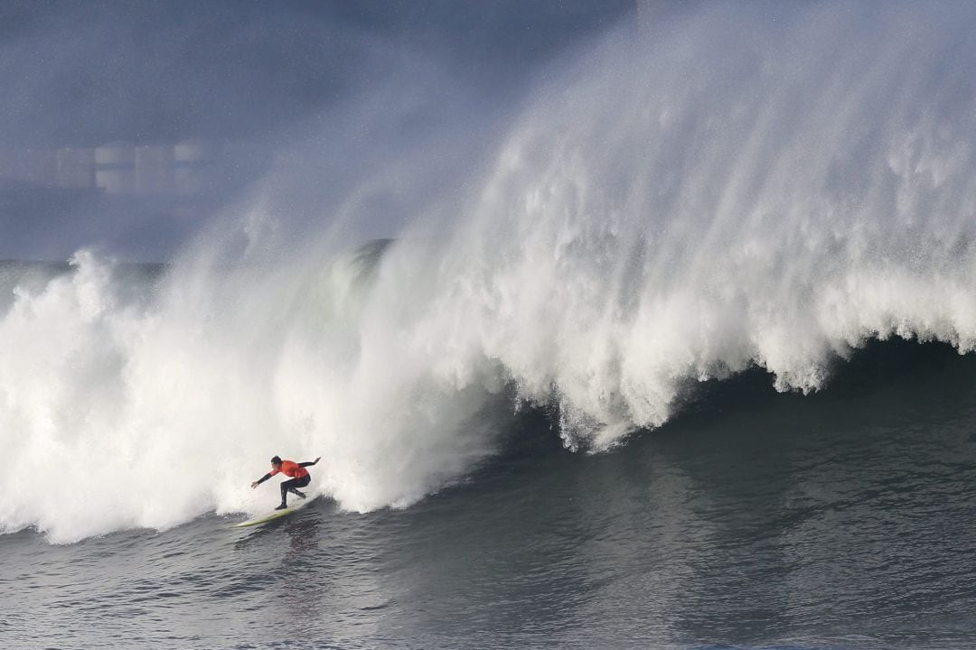 A surfer rides a wave during the Punta Galea Big Wave Challenge in Punta Galea, Getxo, near Bilbao, Spain, December 10, 2018