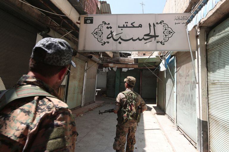 Syria Democratic Forces (SDF) fighters inspect a centre that was used by Islamic State religious police (al-Hisbah) in Manbij, Aleppo Governorate, Syria, August 16, 2016. REUTERS Rodi Said