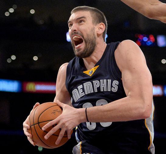 LOS ANGELES, CA - NOVEMBER 26: Marc Gasol #33 of the Memphis Grizzlies drives to the basket under the arm of Wesley Johnson #11 of the Los Angeles Lakers during a 99-93 Grizzlies win at Staples Center on November 26, 2014 in Los Angeles, California. NOTE 