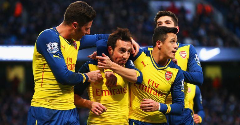 MANCHESTER, ENGLAND - JANUARY 18:  Santi Cazorla of Arsenal (2L) celebrates with team mates as he scores their first goal from a penalty during the Barclays Premier League match between Manchester City and Arsenal at Etihad Stadium on January 18, 2015 in 