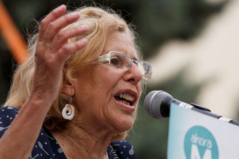 MADRID, SPAIN - MAY 13:  &#039;Ahora Madrid&#039; party leader, Manuela Carmena speaks to members of the public during an election campaign rally at the Cornisa Park on May 13, 2015 in Madrid, Spain. The rally was organized by &#039;Podemos&#039; (We can) and &#039;Ahora Madrid&#039; 