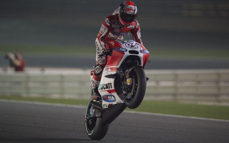 DOHA, QATAR - MARCH 27:   Andrea Dovizioso of Italy and Ducati Team  lifts the front wheel during the MotoGp of Qatar - Free Practice at Losail Circuit on March 27, 2015 in Doha, Qatar.  (Photo by Mirco Lazzari gp/Getty Images)